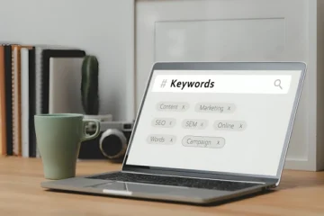 Laptop screen showing SEO keyword research and digital marketing tags illustrating the role of keywords in search engine optimization