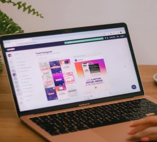 Laptop displaying Instagram feed dashboard on a desk, representing anonymous social media browsing and online privacy tools