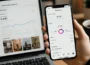 Instagram creator checking Reels analytics and engagement metrics on a smartphone with Instagram performance dashboard on laptop screen